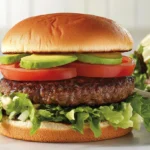 A healthy hamburger with fresh vegetables and whole-grain bun.